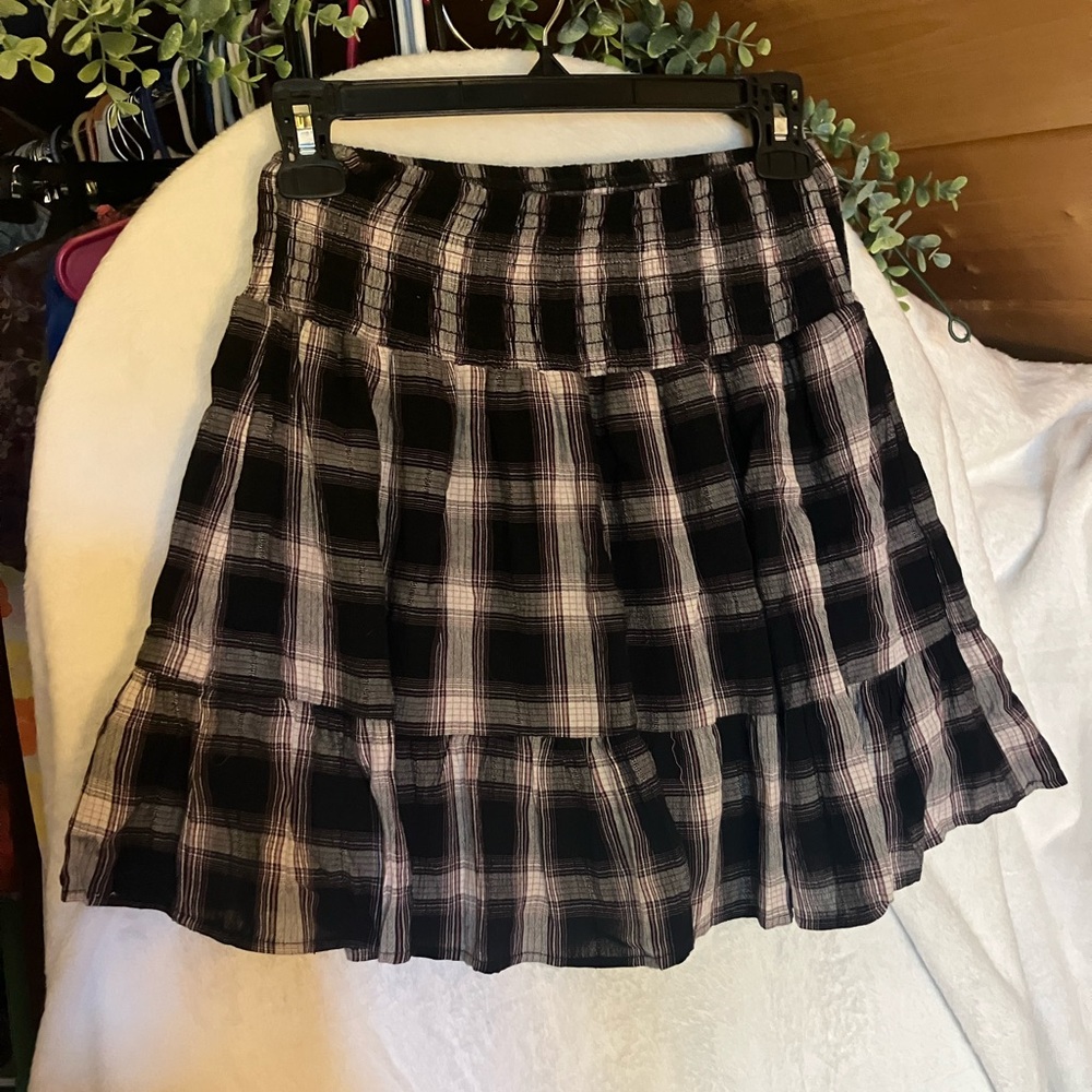 Plaid black & white skirt with a touch of pink hues